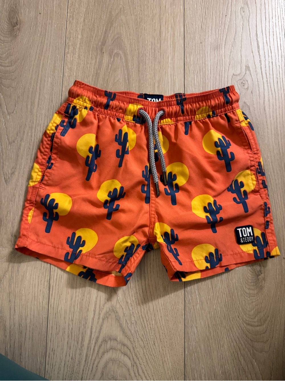 Tom & Teddy Orange Swim Shorts with Yellow Sun & Navy Cactus Print